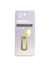 Load image into Gallery viewer, Arabic metal bookmark in brass. Shape of a damma diacritic
