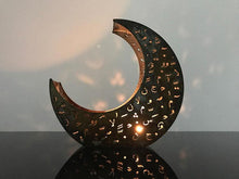 Load image into Gallery viewer, crescent shaped candle holder in rusted metal with laser cut design of Arabic letters & diacritics