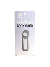Load image into Gallery viewer, Arabic metal bookmark in steel. Shape of a sukun diacritic
