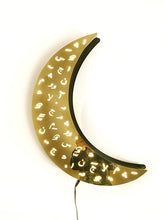 Load image into Gallery viewer, Crescent ramadan wall light in gold mirror stainless steel with laser cut design of Arabic diacretics. 
