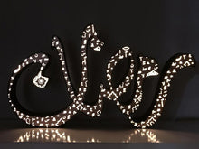 Load image into Gallery viewer, A 1m long ramadan decoration, 3D free standing sign light of the term &quot;Ramadan&quot; in Arabic calligraphy. Metal front with arabic letters cutout
