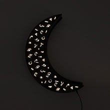 Load image into Gallery viewer, Crescent wall light ramadan decoration with arabic diacritics. light on in darkness.
